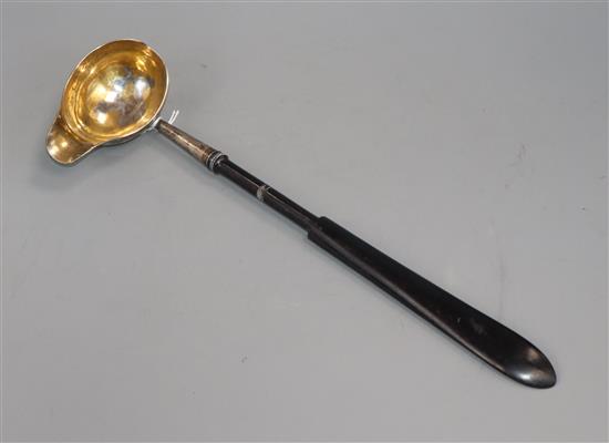 An antique German parcel gilt silver punch ladle, with ebonised handle